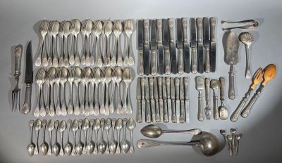 a lot of silver spoons and spoon knives on the table