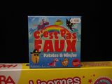 two boxes of cereal and a box of candy on a table