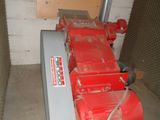 a red machine that is sitting in a room