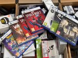 a box full of video games and video game controllers