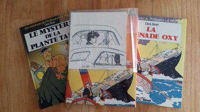 three books that are sitting on a table