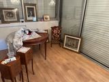 an image of a living room with wood floors and a sliding glass door