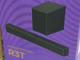 purple box of a sound bar sitting on top of a table