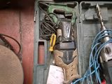 a tool box with tools in it sitting on the floor