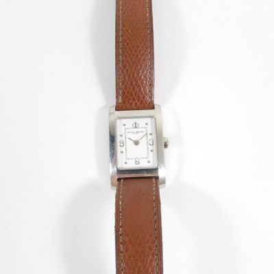 an image of a close up of a wrist watch on a white surface