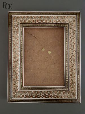 a close up of a picture of a picture frame on a wall