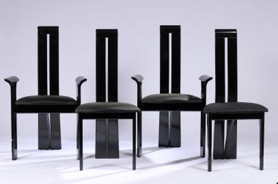 three black chairs with black leather upholstered seats sit side by side