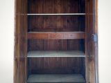 an image of a wooden cabinet with a door open