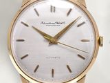 an image of a close up of a wrist watch on a white surface