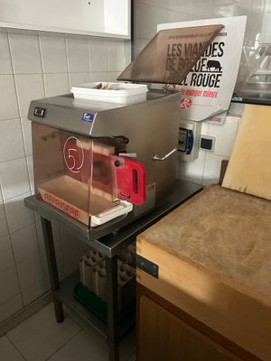 a machine that is sitting on a table in a kitchen