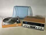 a turntable and a record player sitting on a table