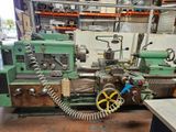 a machine that is sitting in a room with a lot of tools