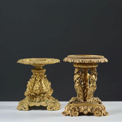 pair of antique brass candlesticks with lion heads on bases