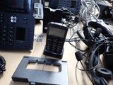 a lot of telephones that are sitting on a table