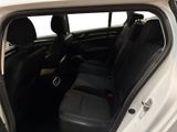 a white car with black leather seats in the back of it