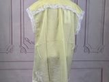 an image of a yellow dress on a mannequin
