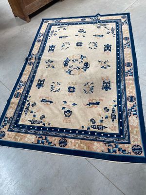 an oriental rug on the floor in a living room