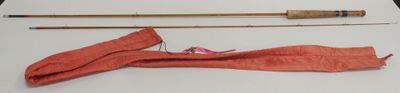 two different types of fishing rods on a table