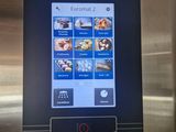 an image of a restaurant app on a stainless steel refrigerator