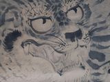 a painting of a tiger and a cat on the wall