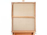 a small easel with a canvas on top of it
