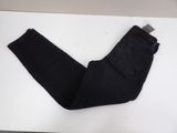 black jeans on a white table with a white background