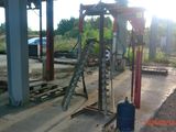 an image of a construction site with a ladder and a water tank