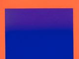 an orange and blue square on a red background