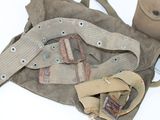 a bag with a belt and some other items on the table