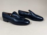 a pair of blue loafers with a leather sole and a rubber sole