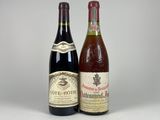 deux bouteilles de vin posées l'une à côté de l'autre sur une table