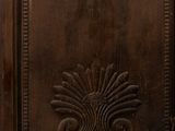 an old wooden door with a decorative design on it