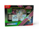a box of pokemon cards with a keychain on top of it