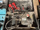 a tool box with tools in it sitting on the floor