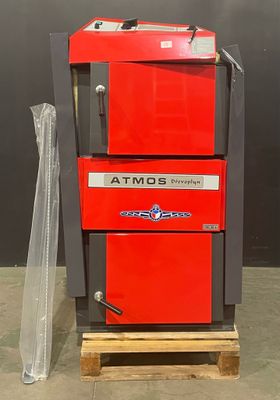 a red machine that is sitting on a pallet