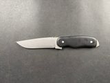 a knife that is laying on top of a table