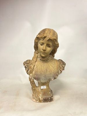 a statue of a woman that is sitting on a table