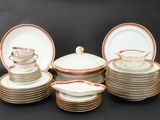 a lot of plates and cups on the table