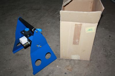 a box and a pair of scissors sitting on the floor