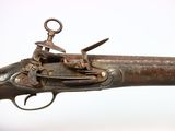 an old gun that is sitting on top of a table