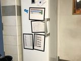 an image of a kitchen with a refrigerator and a stove