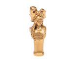 an image of a gold figurine of a woman with a flower in her hair