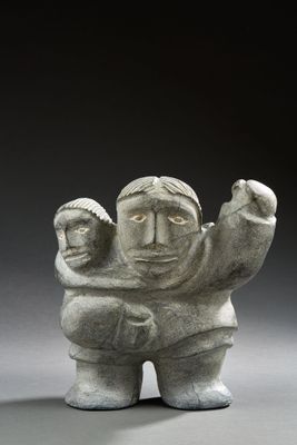 statue of a man holding a child in his arms