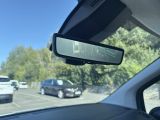 a rear view mirror in the passenger seat of a car