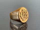 an image of a gold signet ring with a lion on it