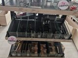 a lot of makeup products on display in a store
