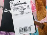 a brown teddy bear with a tag on it ' s neck