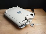 an image of a broken laptop on a wooden table
