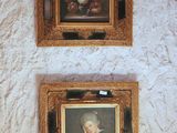 two framed pictures on the wall of a bathroom