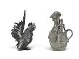 two silver figurines of a bird and a rooster